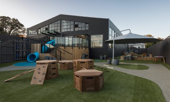 Outdoor area of educational facility with wooden playground