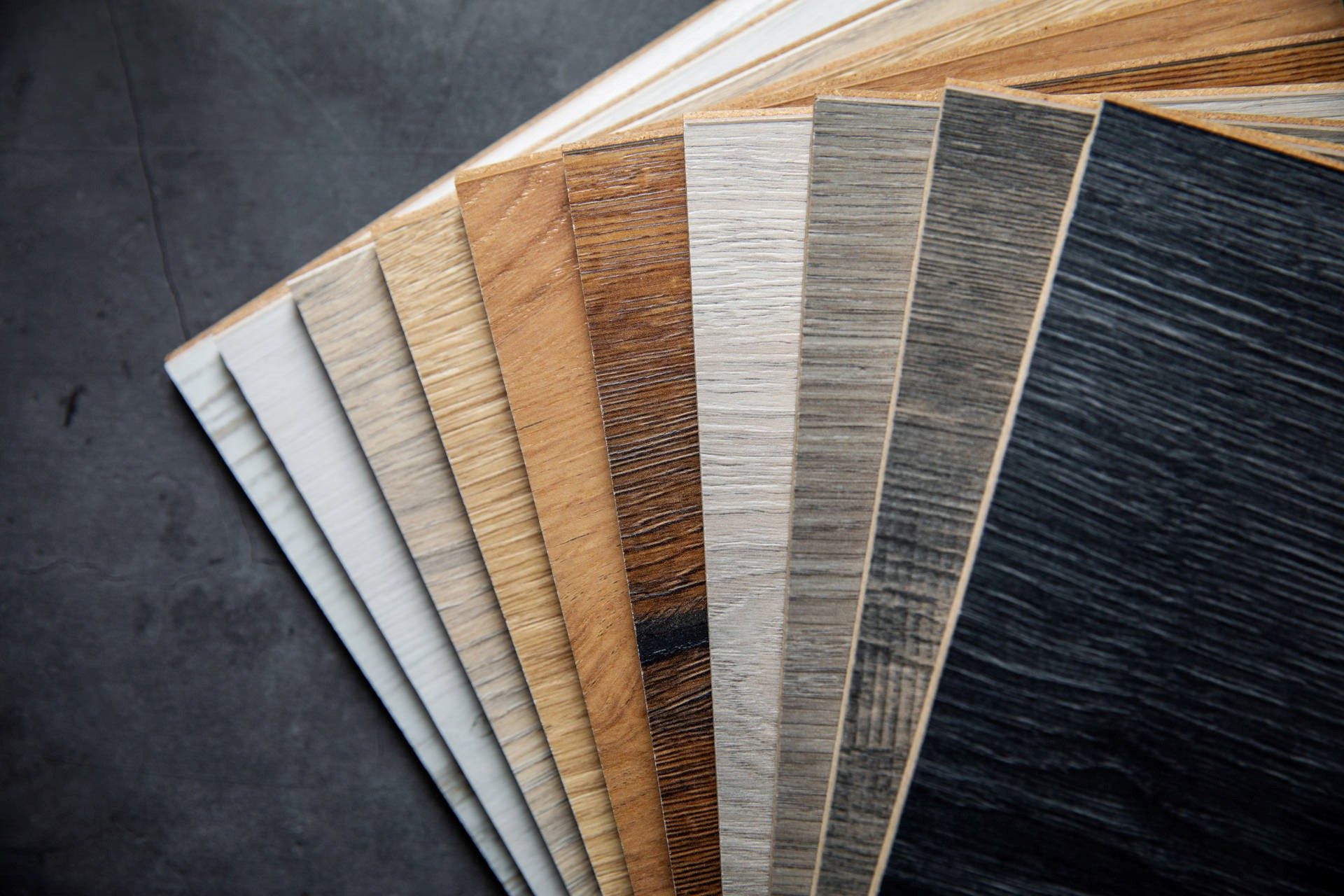 Laminate flooring samples in a range of stains.